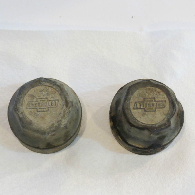 2 vintage chevrolet bowtie hub caps, axle dust covers