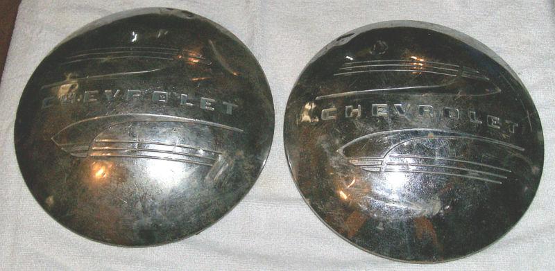 A pr 1947-1949 medal hub caps in good condition