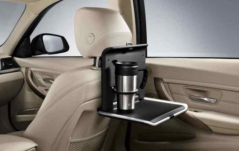 Bmw folding table travel and comfort system