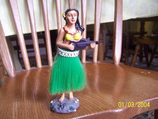Hula doll for your dashboard wiggling her hips 