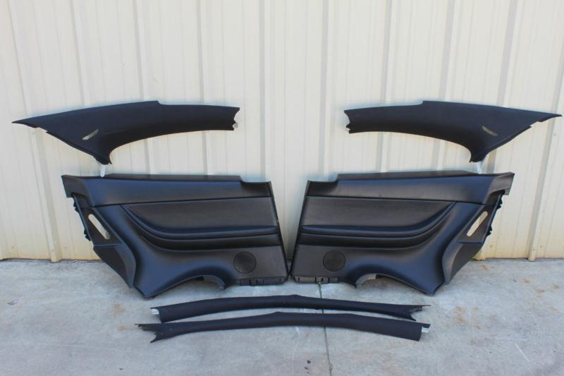 04-06 gto black a-pillars, rear seat & quarter interior panels used oem