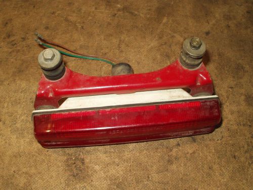 Tail light and bracket plus collars, rubbers, and bolts 1984 honda 200x h49