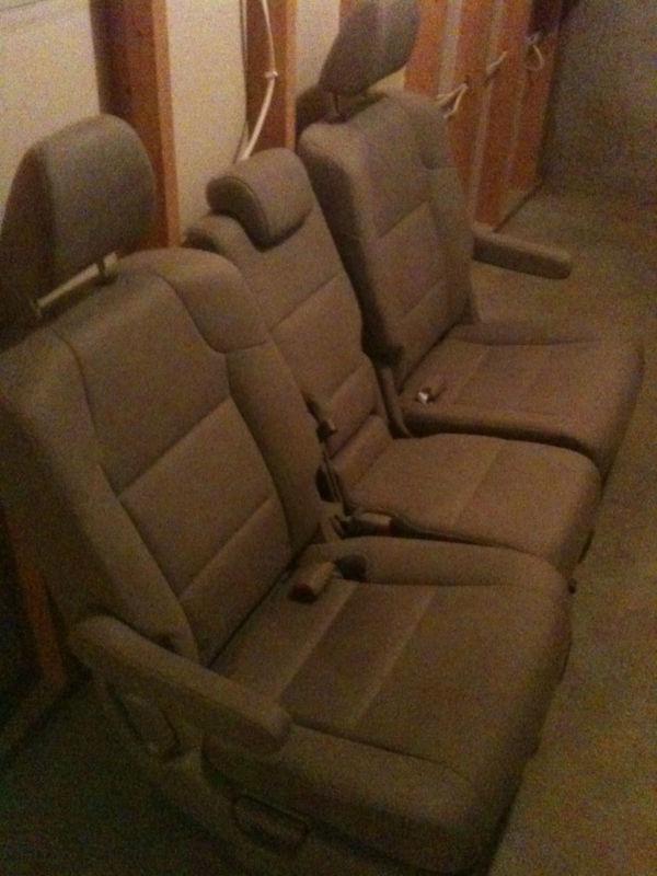 Honda odyssey 2012. 2nd row: two bucket seats and middle seat - tan color, cloth