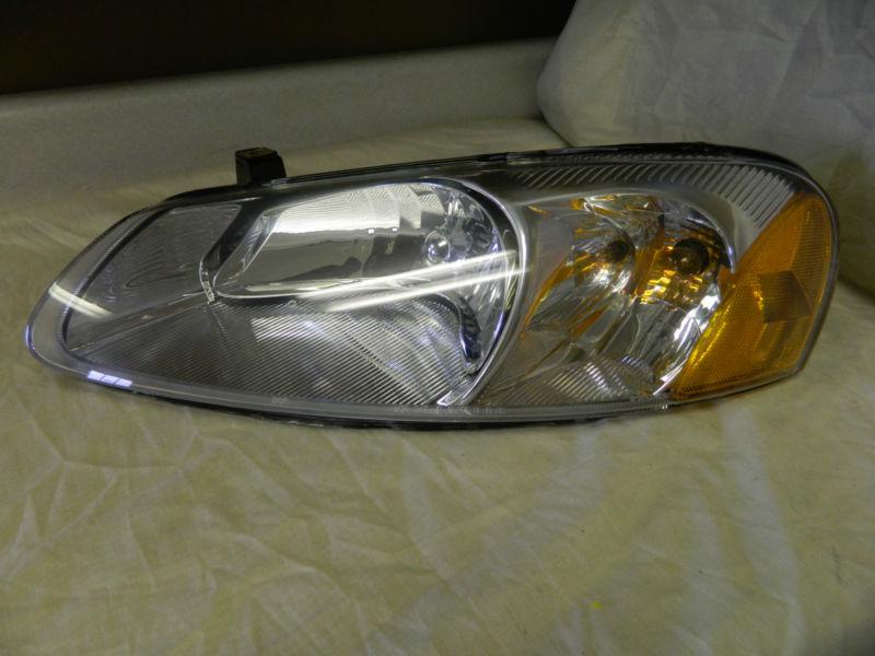 Oem 01-03 chrylser sebring/ 01-06 dodge stratus left/ driver side headlight