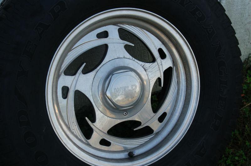 Set of 4 "tarantula" v weld racing wheels and goodyear wrangler at/s tires