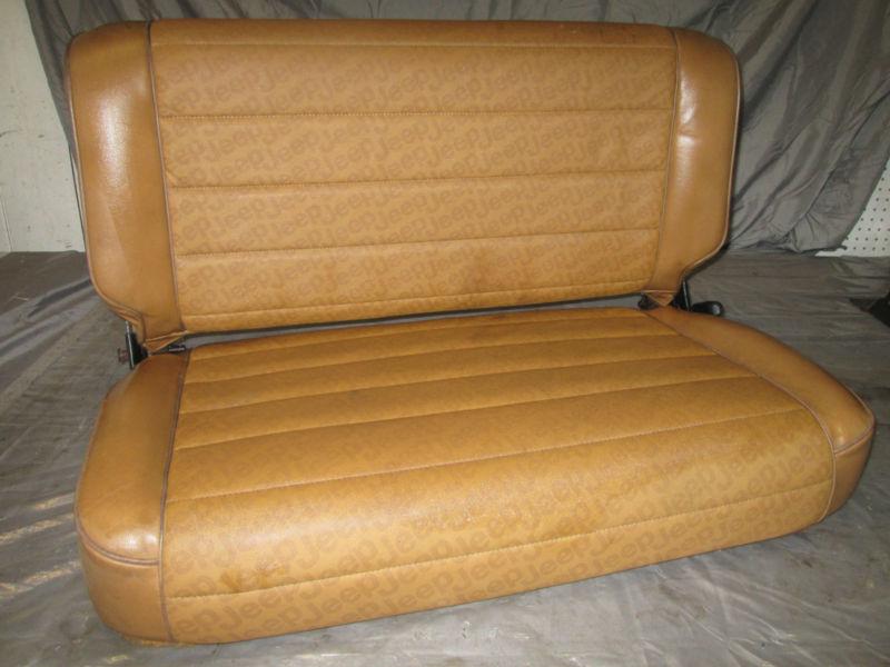 Jeep wrangler  rear fold and tumble seat tan vinyl fits yj and cj