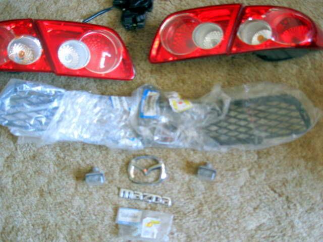 2008 mazda 6 lower grill w brace, l&r tail lights(4), trunk latch, and more!!!