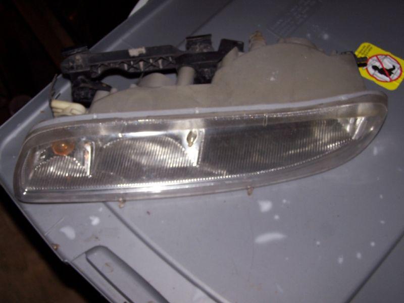 1998 oldsmobile regency  used left headlight assm 98 