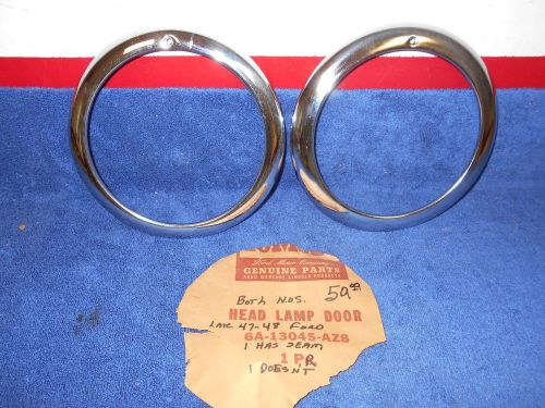 Late 1947-48 ford  headlight bezels rings   pair nos ford 716