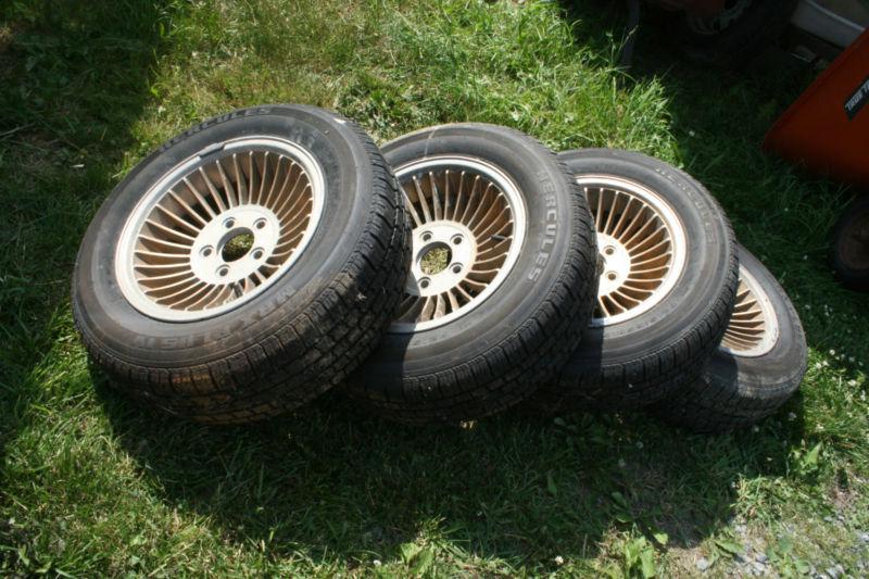 4 hercules mrx plus iv p215/65r15 tires and gold rims