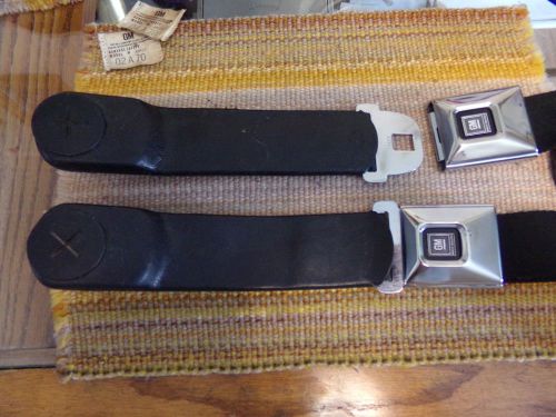 1968-71  gm deluxe male seat belt strap in plastic sleeves pair w/ buckles