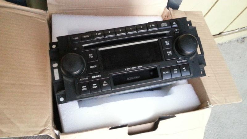 05-10 chrysler/dodge/jeep 6-mp3/cd/wma changer radio tape  in-dash original