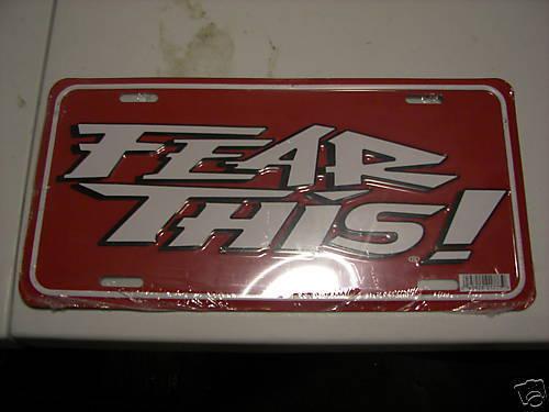 Fear this black plastic and red metal license plate tag