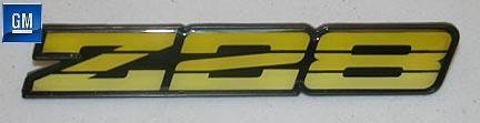 82-92 camaro z28 yellow dash emblem nos gm  1991