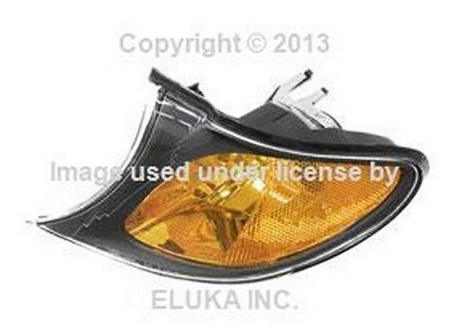 Bmw oem turn signal light with yellow lens and black trim front left e46