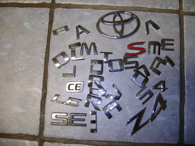 Assorted car emblem letters