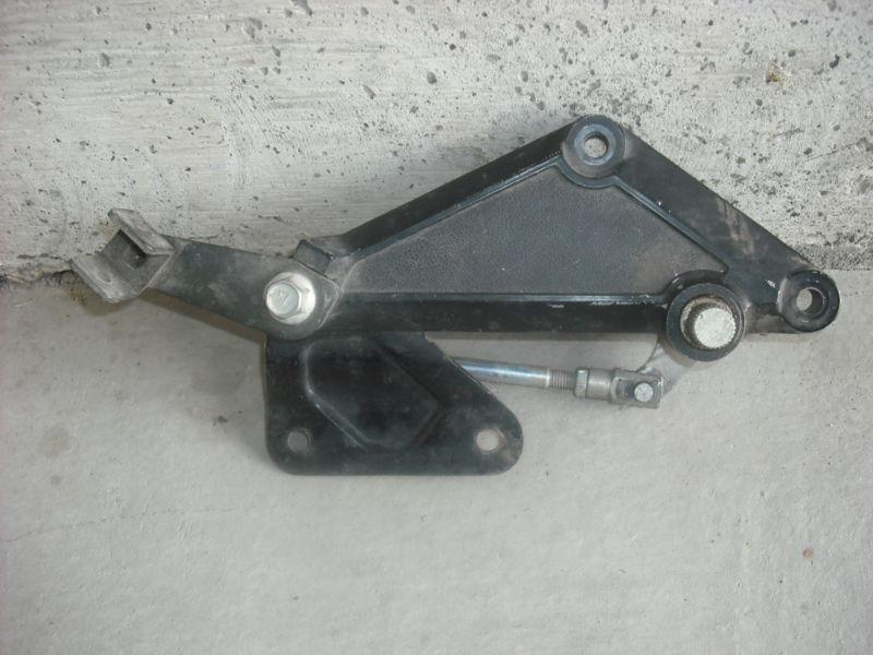 Right side bracket for foot peg, brake pivot, and muffler bracket