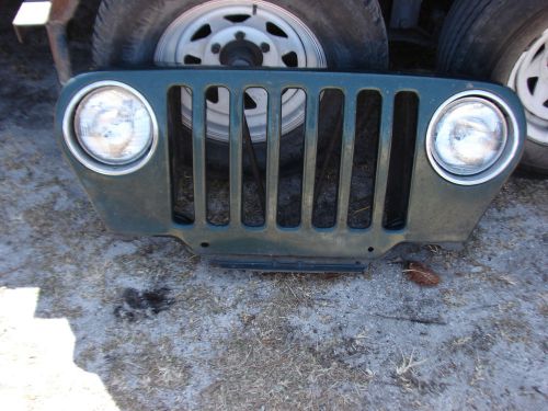 1999, jeep tj grill, complete with lights with no damage and no rust