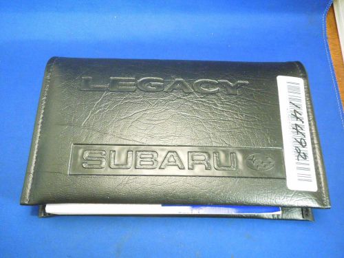 Vintage subaru legacy manual and papers with black leather case booklet
