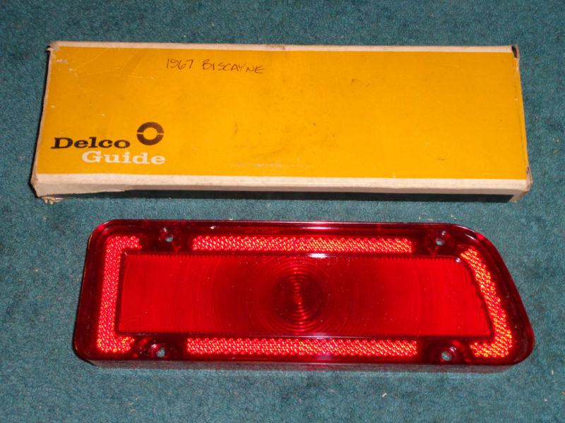N.o.s. 1967 chevrolet biscayne taillight lens rh / n.o.s. guide in orig box