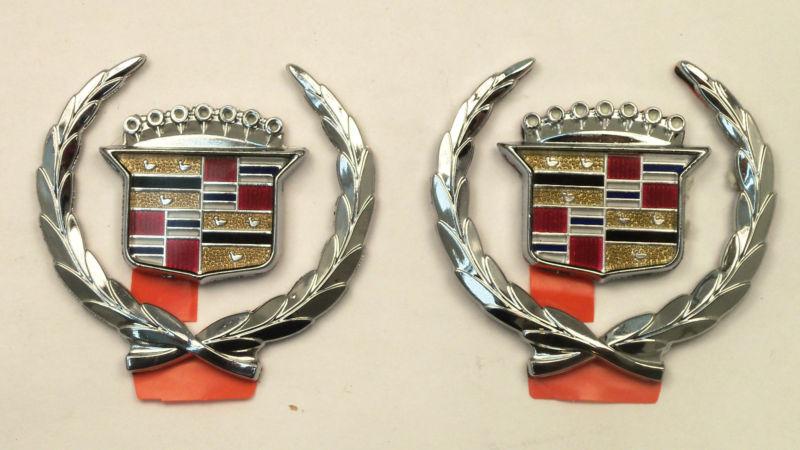 New oem cadillac roof crest & wreath emblem set 4 pieces beautiful! nos