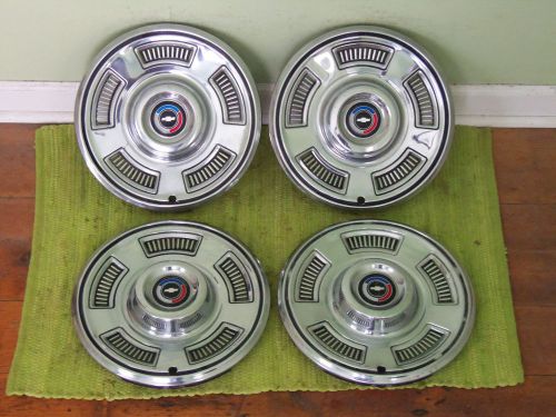 1967 chevrolet hub caps 14&#034; set of 4 chevy hubcaps red white &amp; blue 67