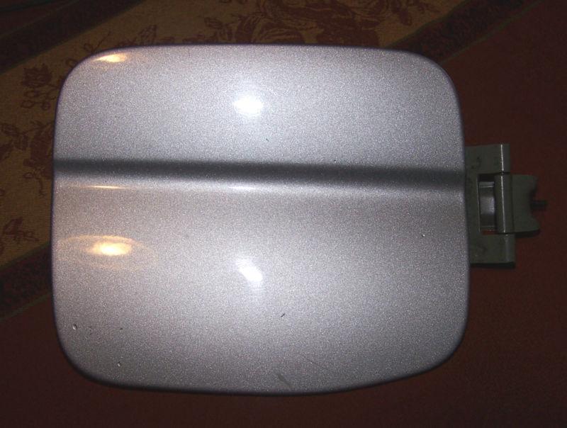Subaru forester 03-06 fuel door lid cover with hinge. gray silver color.