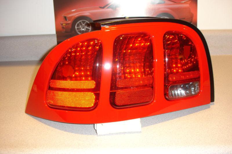 96 97 98 ford mustang driver left rear taillight assembly #1 nos rio red