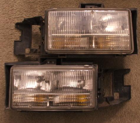 93-96 cadillac fleetwood headlights with mounting brackets