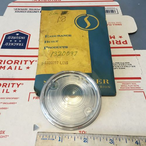 Studebaker clear plastic lens;  nos and damaged.  pn 1320097.   items:  4496