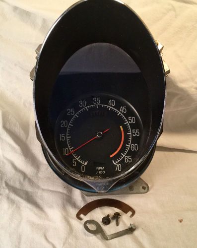 1976 corvette tachometer with lens and housing and bezel