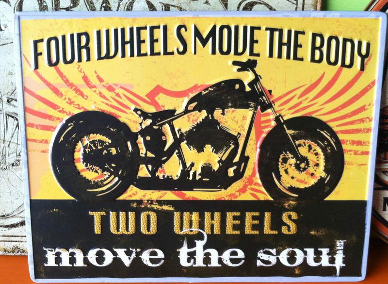 Four wheels move the body two wheels move the soul motorcycle  man cave garage.