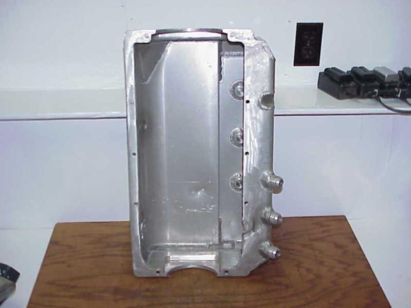 Champ aluminum dry sump oil pan for sb chevy with 3 pickups needs repaired