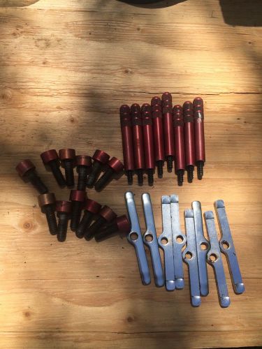 Red anodized quick release valve cover holddowns