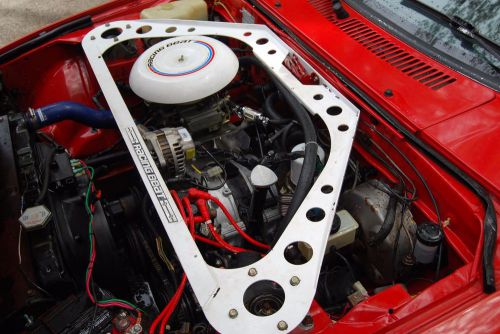 Atkins street ported 12a engine and racing beat intake with holley carb