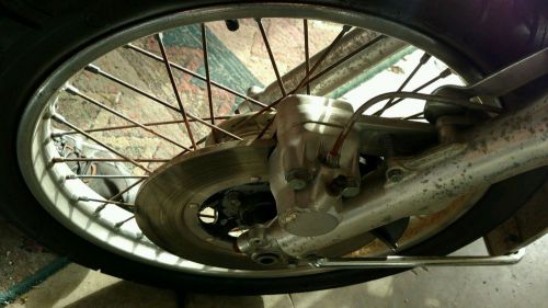 1975 honda cb360 front rim with new tire. look free shipping