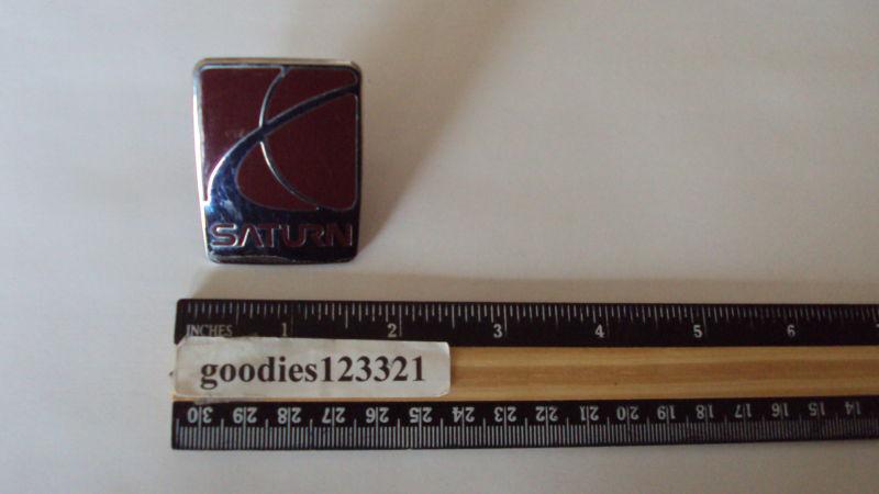 Saturn red and chrome emblem #21111139  used 1 1/2" x 2"