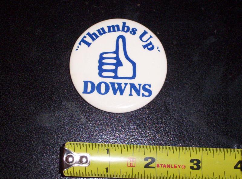 Thumbs up downs pin back button