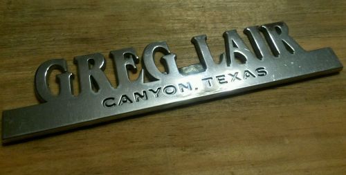 Greg lair--canyon tx-- metal  dealer emblem car  vintage