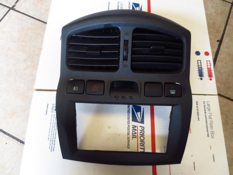 03 santa fe radio stereo bezel dash panel trim w vents hazard, defrost switches