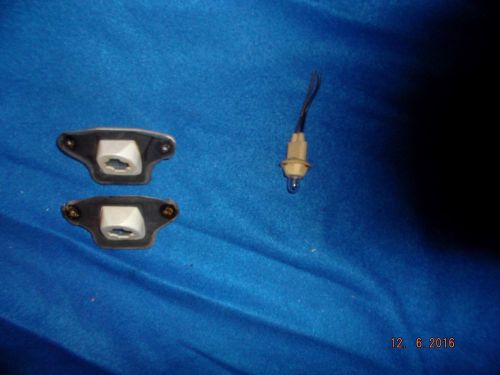 1977 cadillac seville licence plate light lenses and 1 light bulb in good cond.