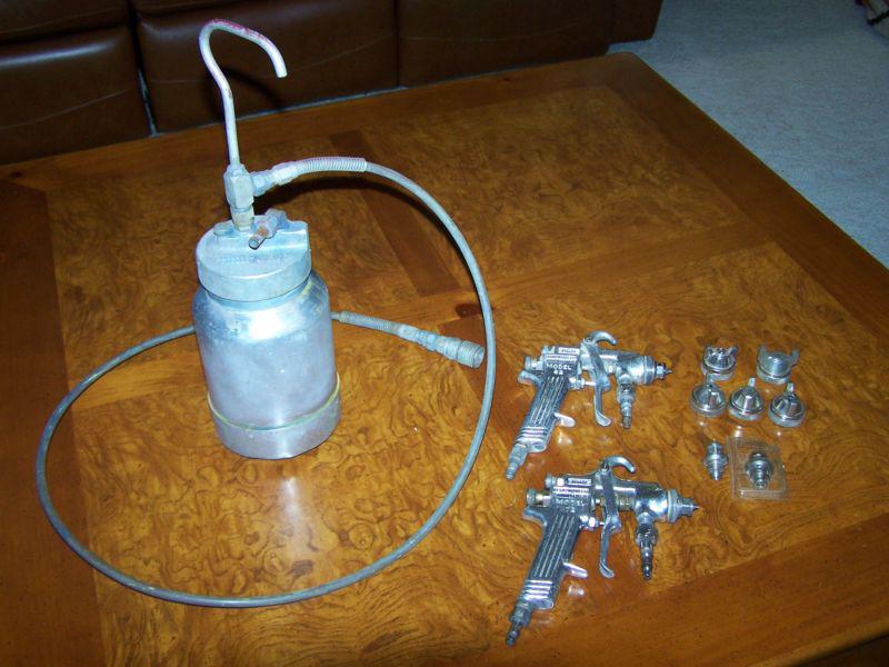 Binks model 62 paint spray gun with 2 quart cup and fluid tips and nozzle caps