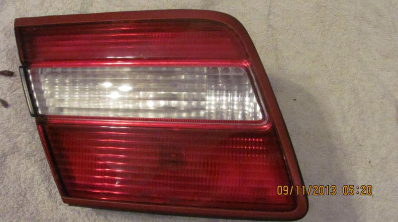 97 98 infinity q45 & q45t driver side / lh trunk lid tail light assembly