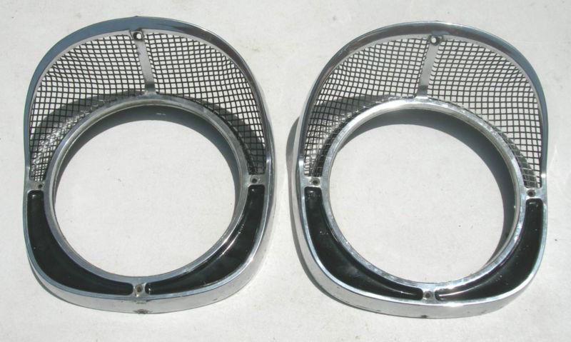 1957 chevy  head light  bezels - right and left