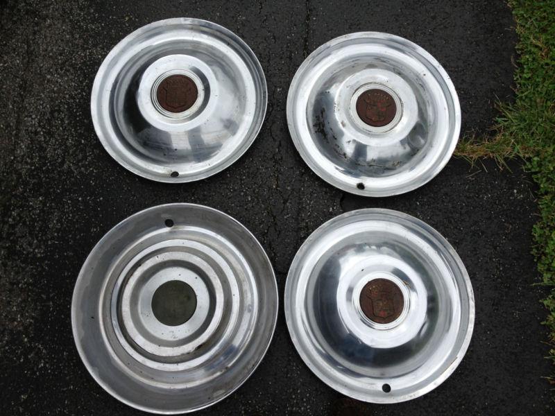 Cadillac hubcaps 1950s  ,4