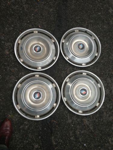 1961 buick hubcaps set.