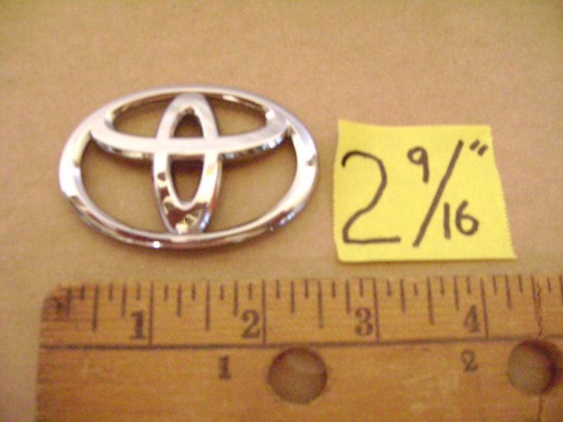 Toyota chrome plastic oval emblem sticker 2 9/16 inches wide corolla rav 4 camry