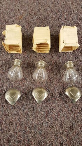 1955 cadillac eldorado nos light bulbs and lens covers with crest vee $165