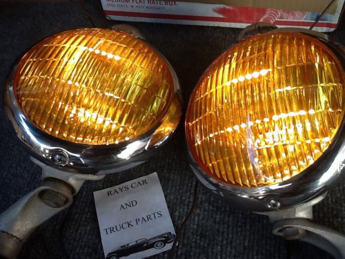 Used complete working pair of 12 volt fog lights with g.m. logo on them