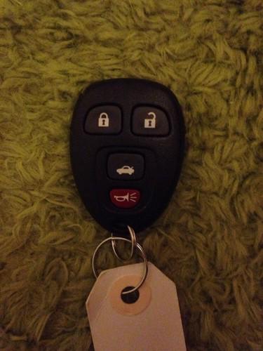 Used gm remote keyless entry fob 4 button gm/l 22733523